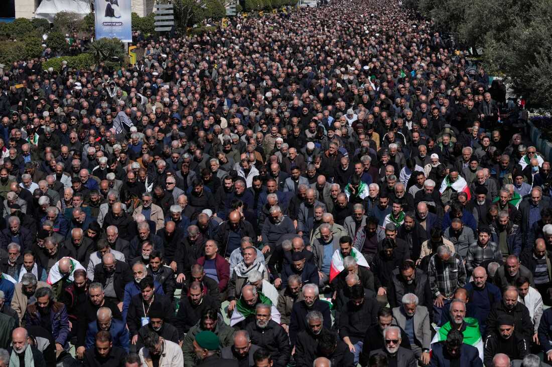 Iranians attend Friday prayers in the courtyard of the Imam Khomeini Grand mosque in Tehran, Iran.