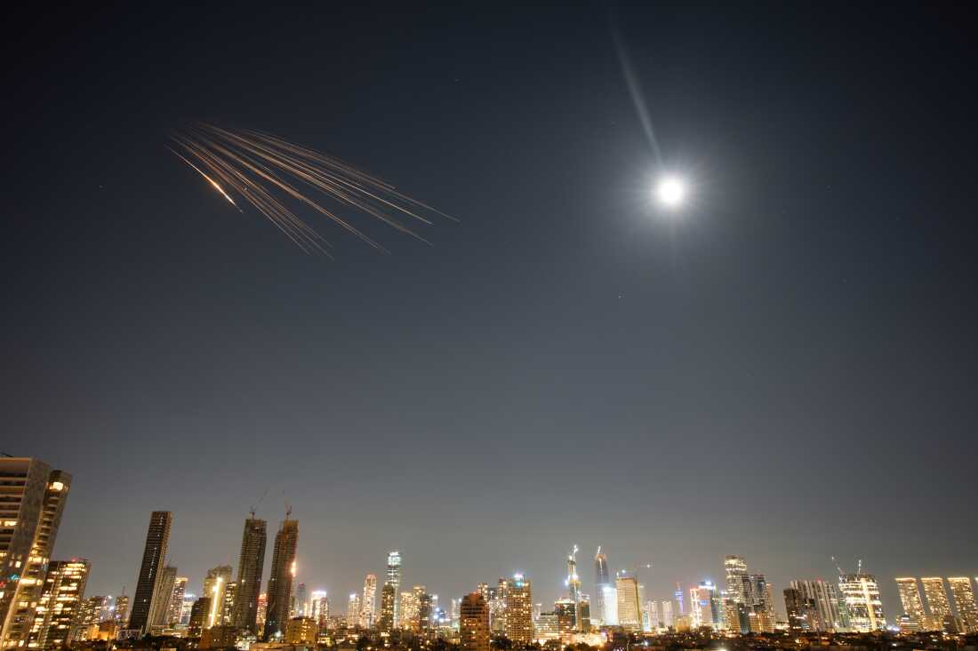 Missiles launched from Iran are seen in the sky over central Israel.