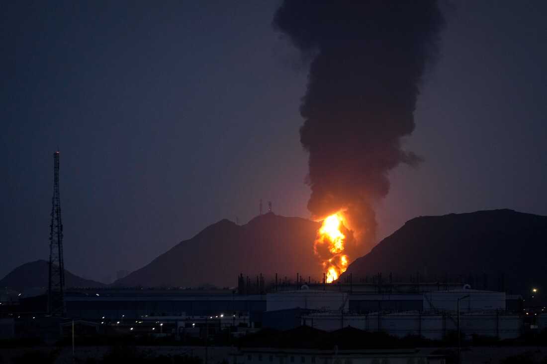 Large fire and plume of smoke is visible after, according to the authorities, debris of an Iranian intercepted drone hit the Fujairah oil facility, in Fujairah, United Arab Emirates.