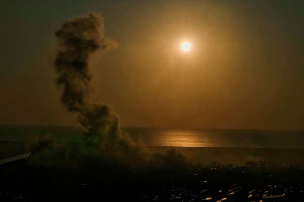 Smoke rise from an Israeli airstrike in Dahiyeh, Beirut's southern suburbs, at sunset in Beirut, Lebanon, Tuesday, March 10, 2026. (AP Photo/Bilal Hussein)