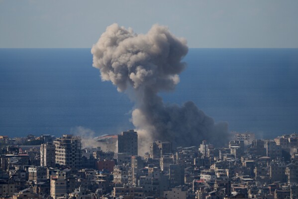 Smoke rise from an Israeli airstrike in Dahiyeh, Beirut's southern suburbs, Monday, March 9, 2026. (AP Photo/Hassan Ammar)