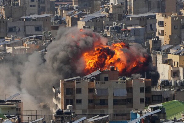Flames rise after an Israeli airstrike in Dahiyeh Beirut's southern suburbs, Monday, March 9, 2026. (AP Photo/Hassan Ammar)