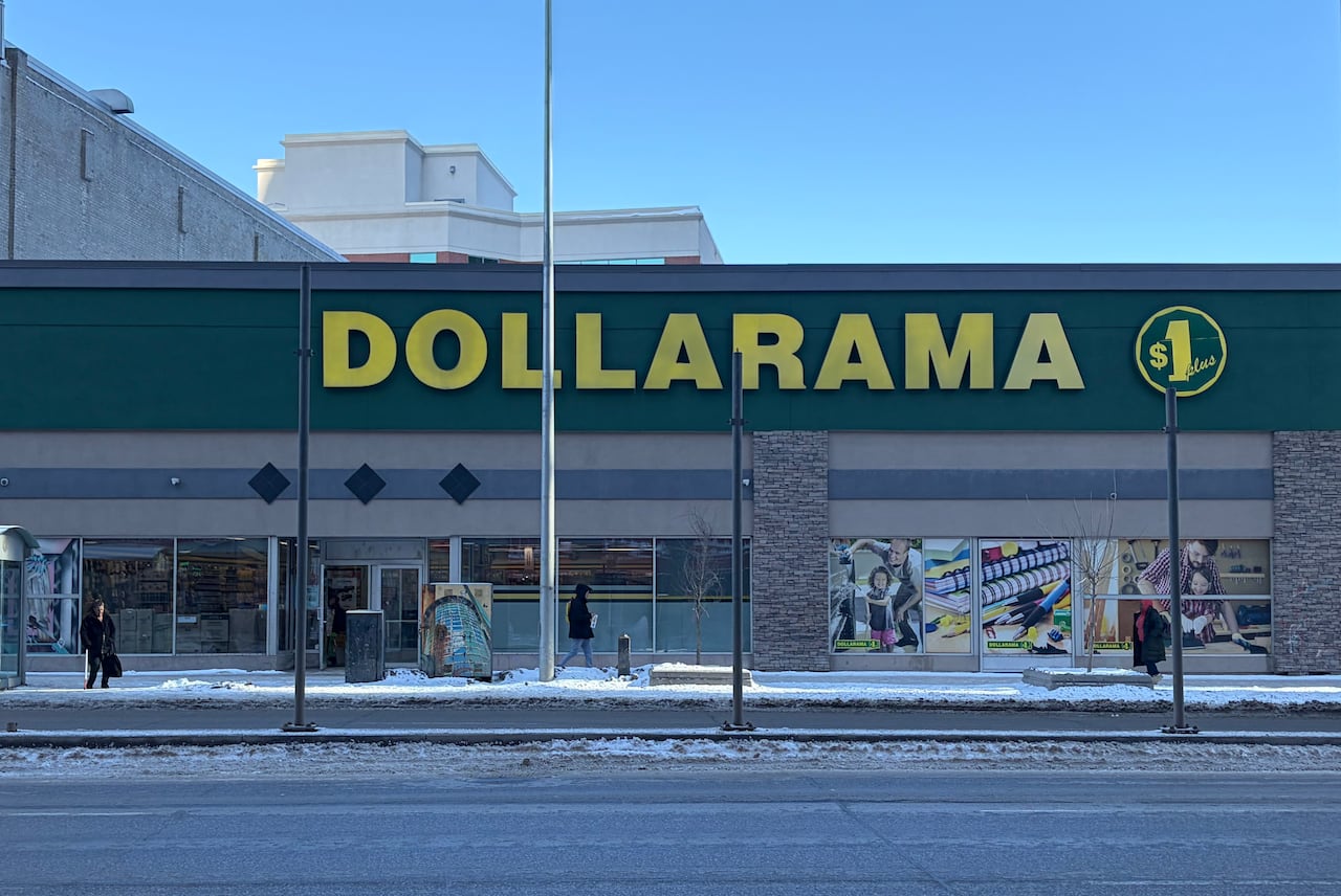 The exterior of a Dollarama store is shown on a city street.