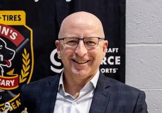 a smiling hockey coach
