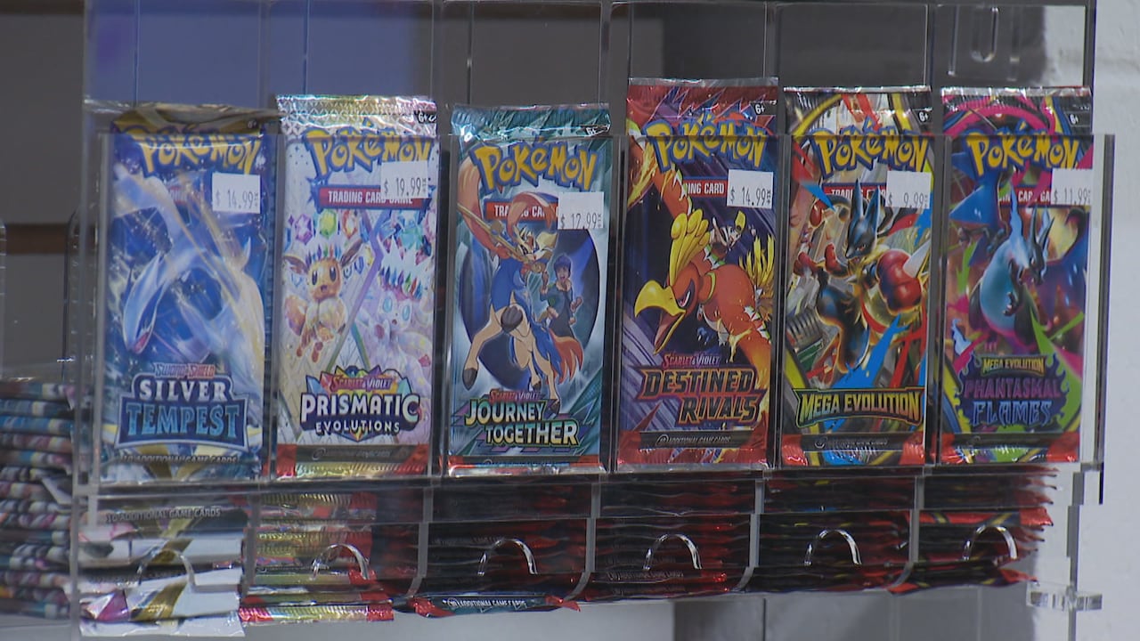 A row of card packs with cartoon animals on them.