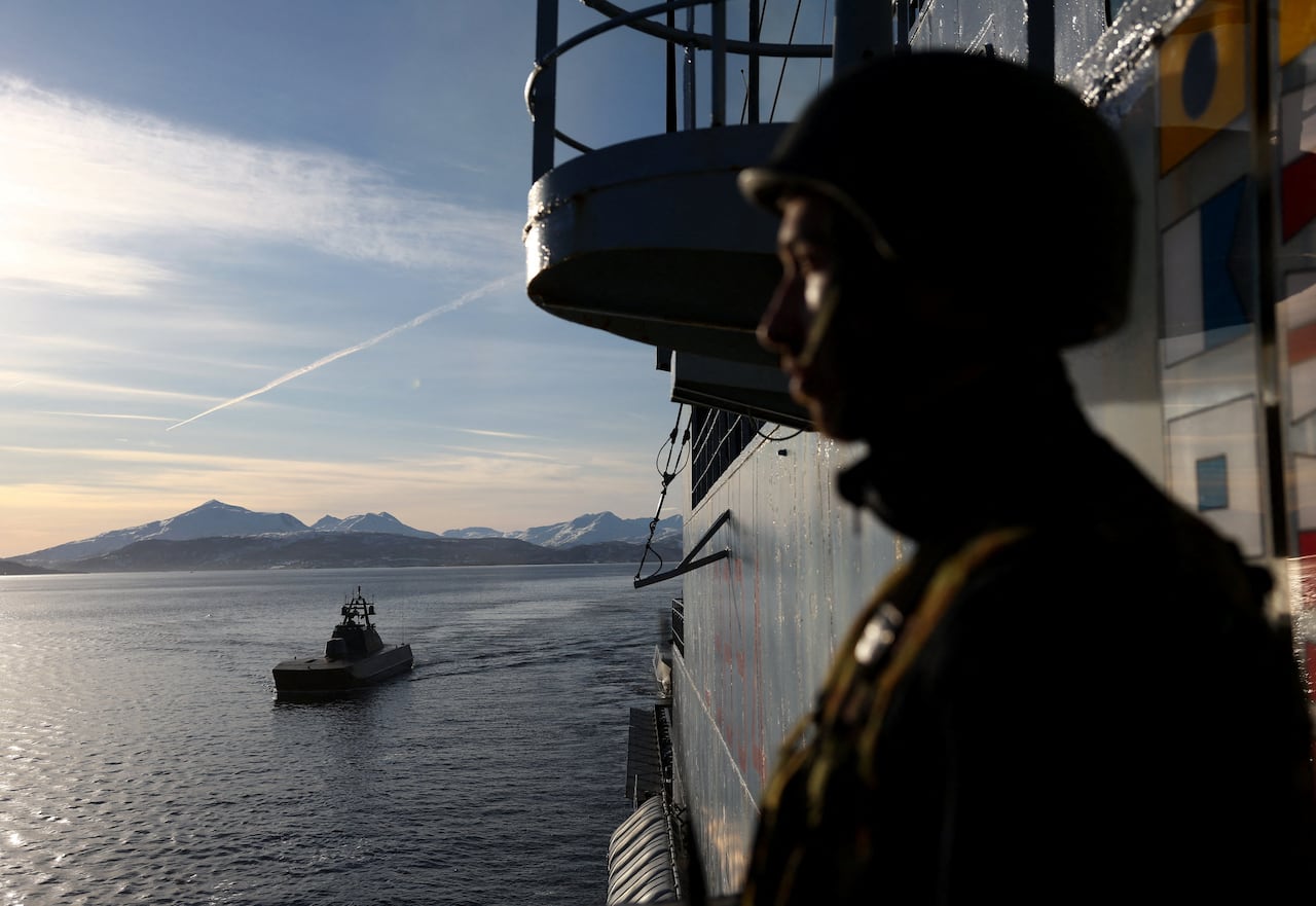 A soldier is seen in Arctic waters.