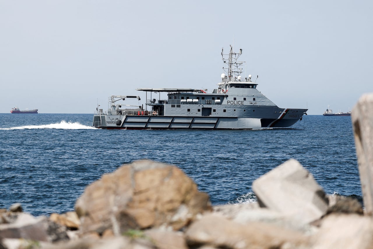 A patrol boat passes by on the sea.