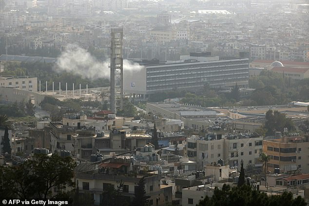 Smoke rises after an Israeli strike targeted a campus of the Lebanese University, killing two academics, in the Hadath neighbourhood of Beirut on March 12, 2026. The Israeli military said it had begun a wave of strikes across Beirut, after it warned residents of a central neighbourhood of the Lebanese capital it would target a building there. Lebanon was drawn into the Middle East war last week when Iran-backed militant group Hezbollah attacked Israel in response to the killing of the Iranian supreme leader during US-Israeli strikes. (Photo by ibrahim amro / AFP via Getty Images)
