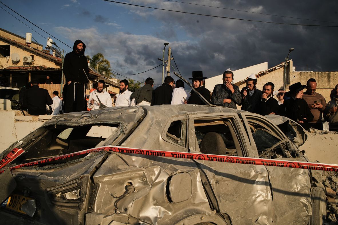 People gather at the site of a deadly missile strike in Beit Shemesh, Israel, on March 1.