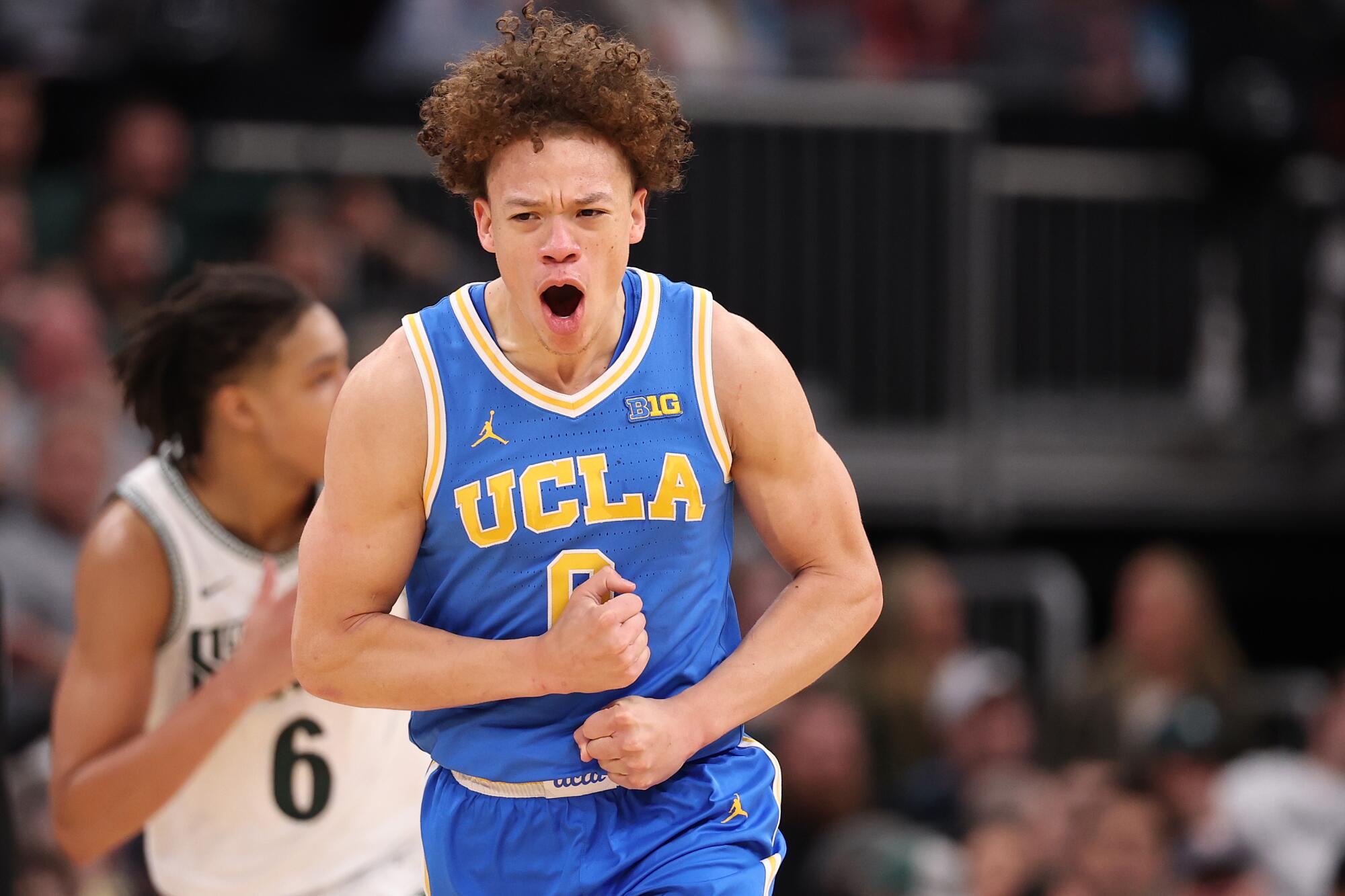 UCLA's Trent Perry celebrates after shooting a three-pointer against Michigan State in the first half Friday.