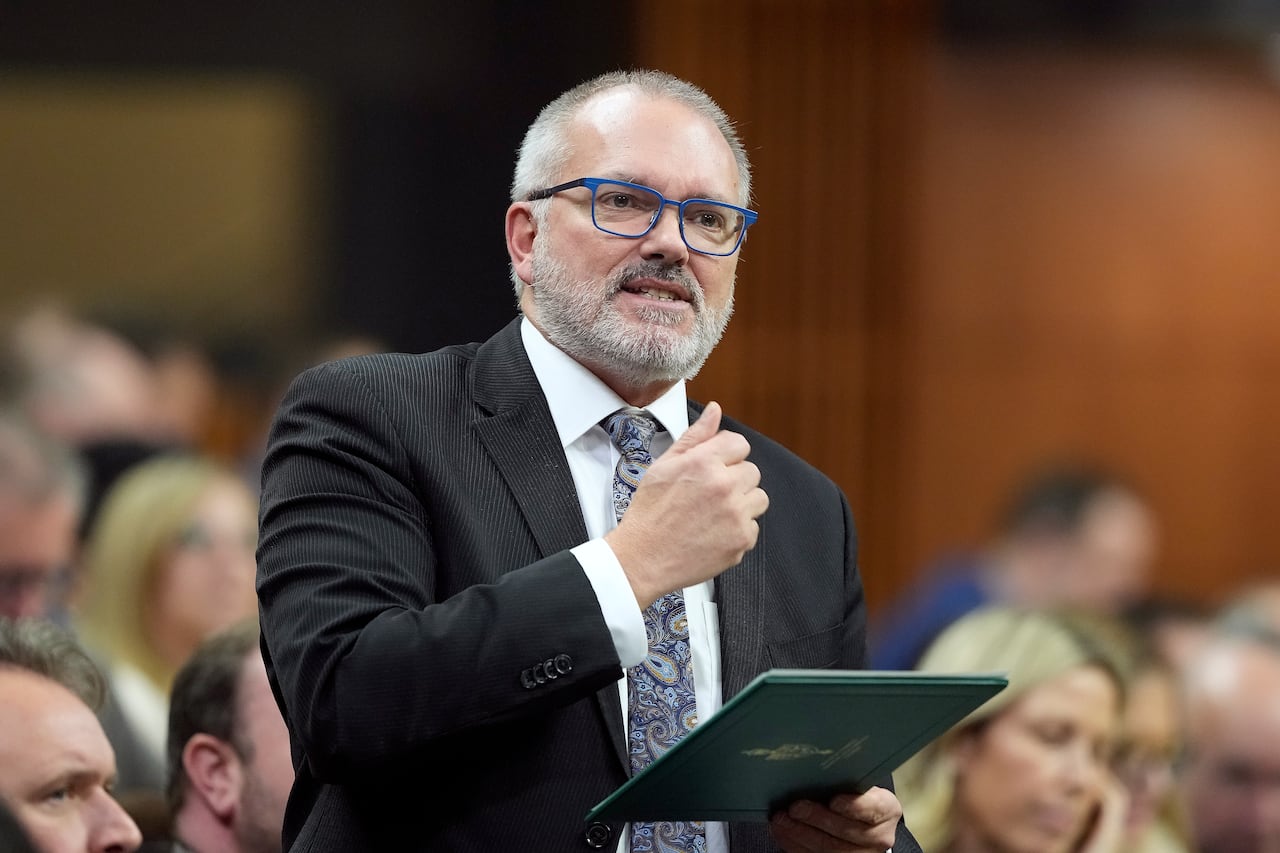 A man in a suit in the House of Commons.