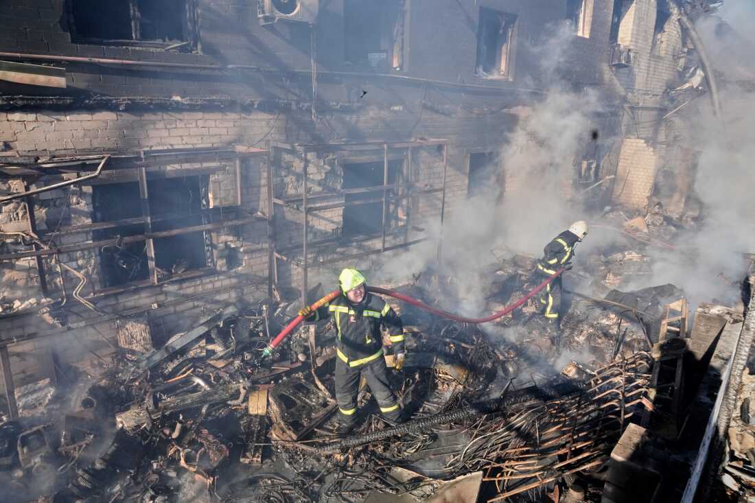 Firefighters put out the fire at a residential neighbourhood following a Russia missile and drone attack, in Brovary, close to Kyiv, Ukraine, on Saturday.