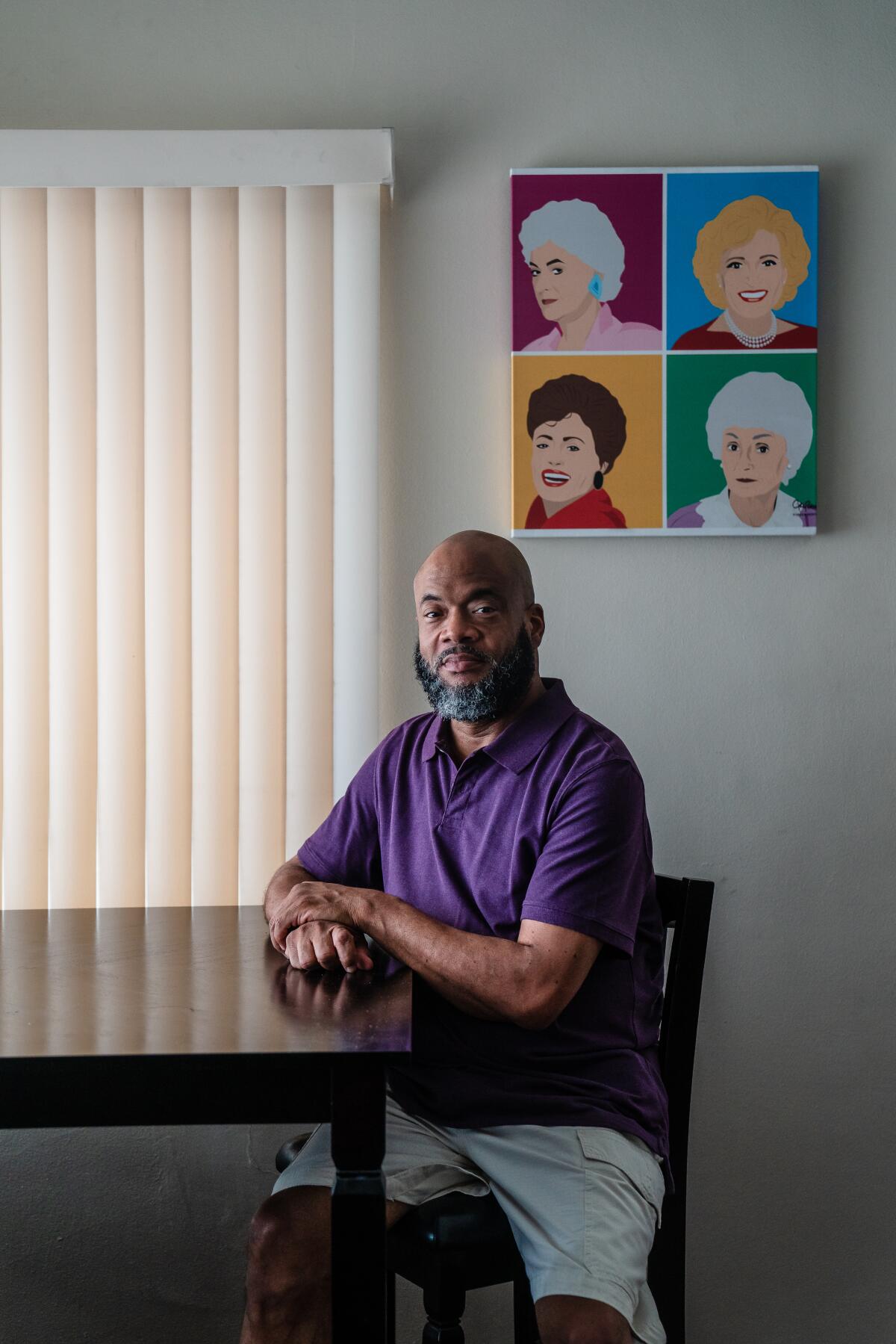 A man sits in his apartment in Los Angeles. 