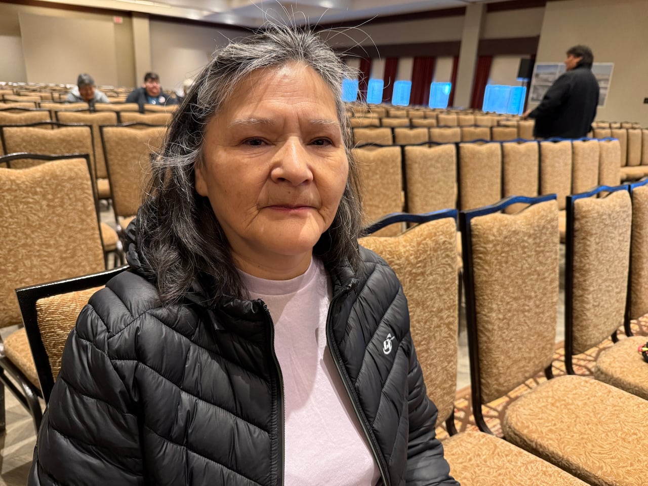 A woman wearing a black jacket.