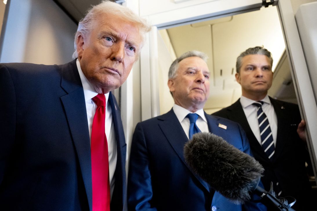 President Donald Trump speaks with the media as Defense Secretary Pete Hegseth, right, and special envoy Steve Witkoff, center, look on aboard Air Force One on March 7.