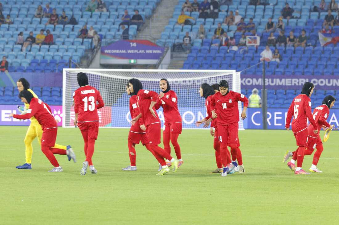 This photo taken on March 8, 2026 shows Iranian players running towards their positions at the start of the AFC Women's Asian Cup Australia 2026 football match between Iran and the Philippines on the Gold Coast.