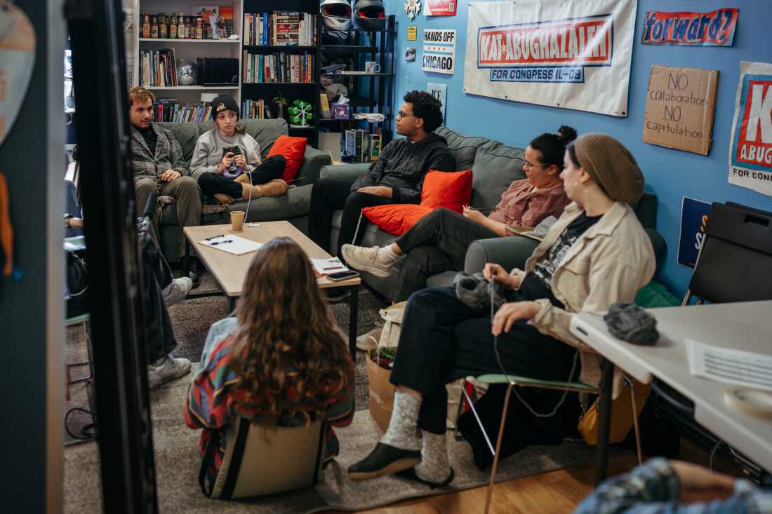 A group of supporters sit with candidate Kat Abughazaleh as they knit and discuss political issues inside her campaign office as she runs in the Democratic primary for Illinois’ 9th Congressional District ahead of the March 17, 2026 primary election, in Chicago, Illinois.