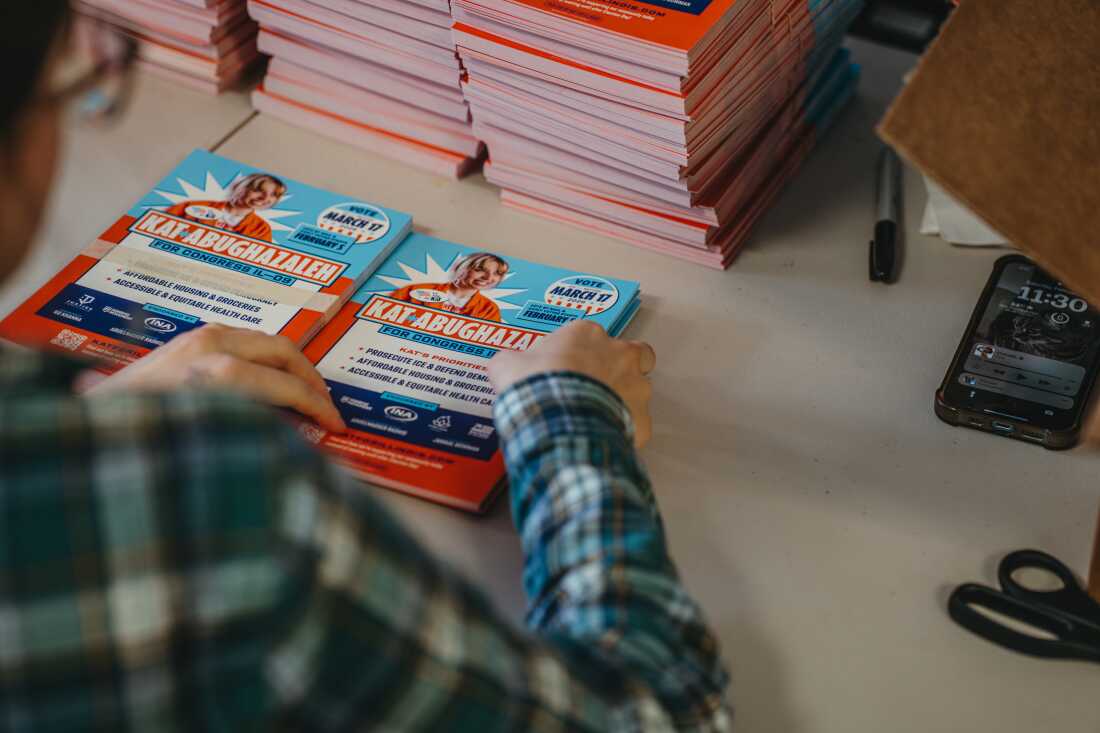 A campaign employee assembles mailers and informational materials for volunteers to distribute inside the campaign office of Kat Abughazaleh, a 26 year old former journalist and content creator running in the Democratic primary for Illinois’ 9th Congressional District ahead of the March 17, 2026 primary election on February 28, 2026, in Chicago, Illinois.