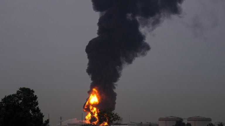 Fire and plumes of smoke rises after s drone struck...