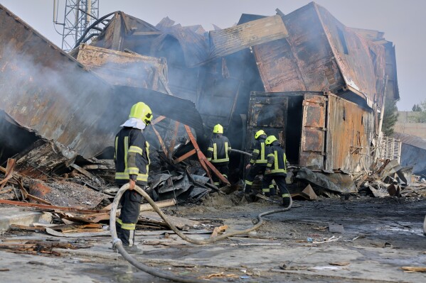 Firefighters work at the site of a late-Monday airstrike at a drug rehabilitation hospital in Kabul, Afghanistan, Tuesday, March 17, 2026. (AP Photo/Siddiqullah Alizai)