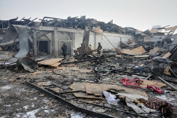 Residents and rescue workers inspect the site of a late-Monday airstrike at a drug rehabilitation hospital in Kabul, Afghanistan, Tuesday, March 17, 2026. (AP Photo/Siddiqullah Alizai)