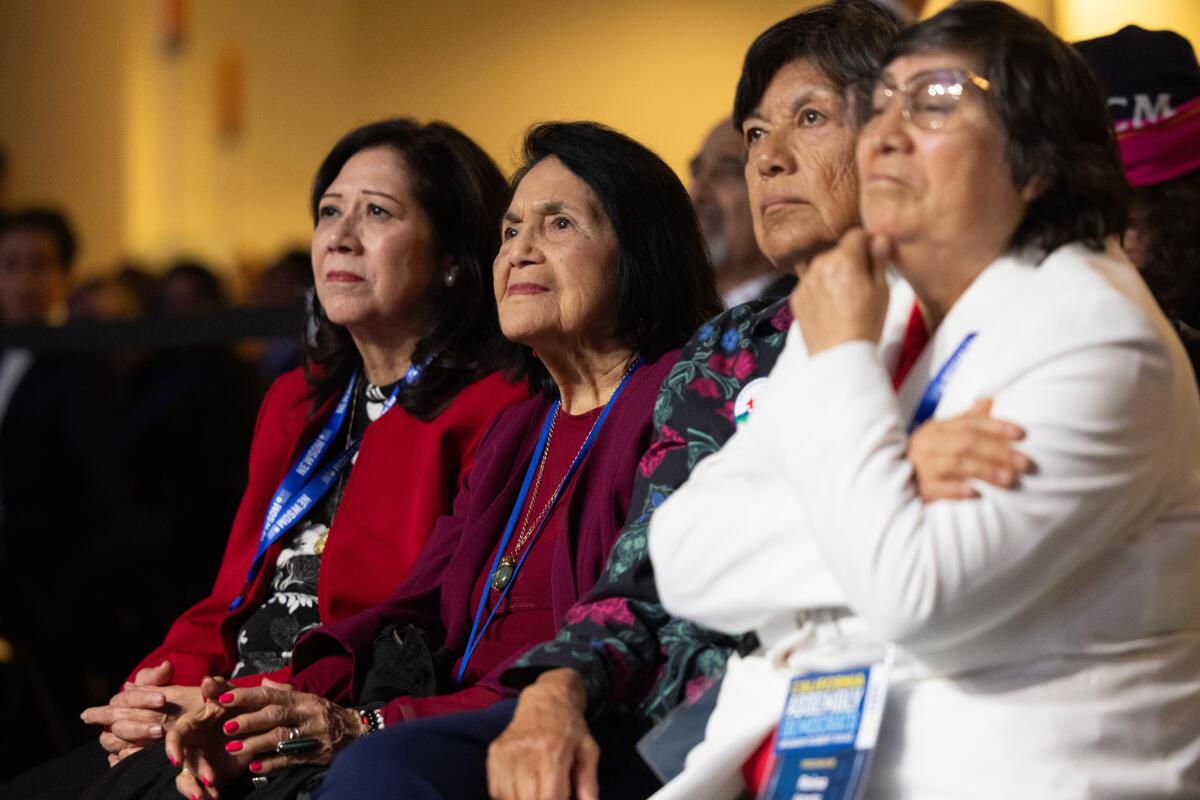 LA County Supervisor Hilda Solis, left, sits with activists Dolores Huerta, Rachel Kirk, and Reina Schmitz