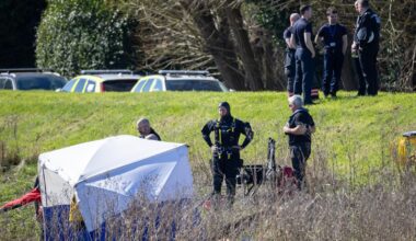 Girl's body found and teenage boy still missing after car carrying five people crashes into river