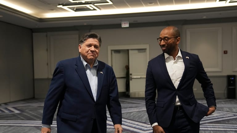 Illinois Gov. JB Pritzker, left, and running mate for lieutenant...