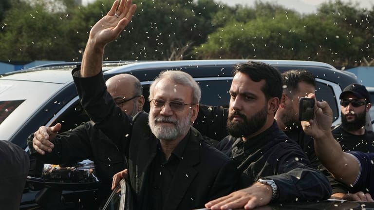 Ali Larijani, center, head of Iran's National Security Council, gestures...