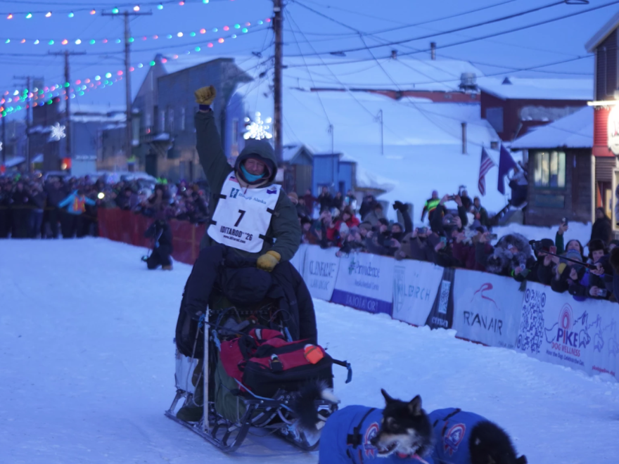 2026 Iditarod Trail Sled Dog Race champion Jessie Holmes arrives at the 1,000-mile race's finish line in Nome the evening of Tuesday, March 17, 2026.
