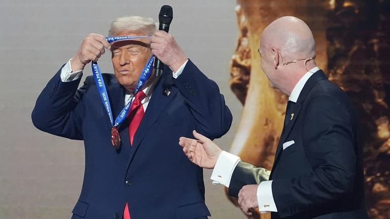 President Donald Trump is presented with the inaugural FIFA Peace...