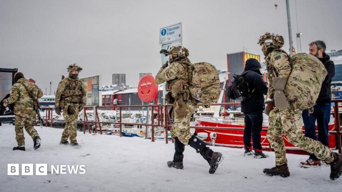 A Danish air force transport plane and military personnel are seen in Greenland's capital Nuuk. Photo: 14 January 2026