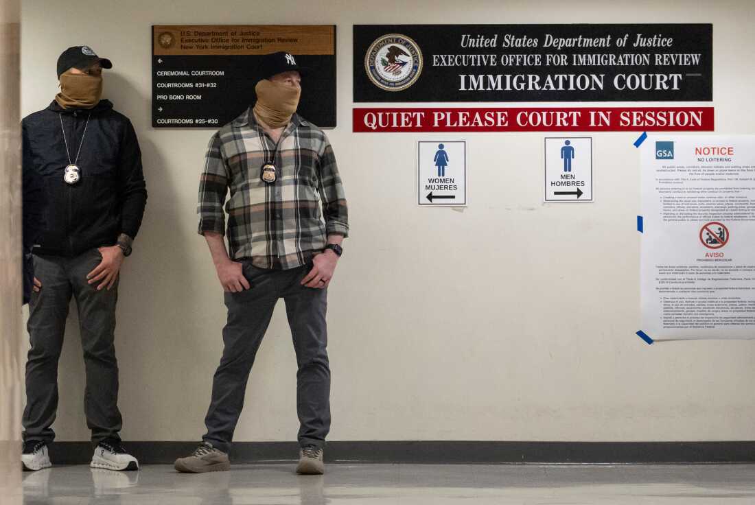 Cases in immigration courts nationwide can be appealed to the Board of Immigration Appeals. Here, federal agents stand outside an immigration court in New York on March 6, 2026.