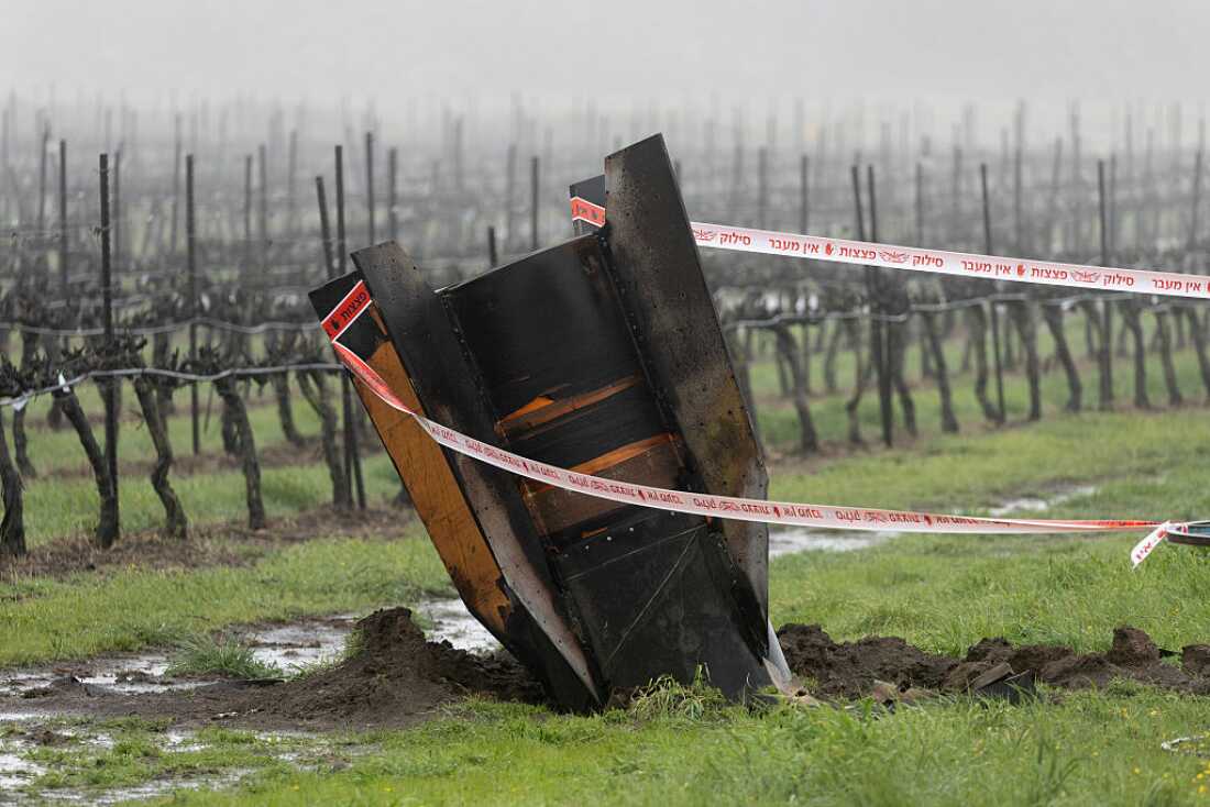 The tail section of a ballistic missile fired from Iran, sticks out of the ground at a vineyard in the Israeli controlled Golan Heights on March 20, 2026 in Golan Heights, Israel.