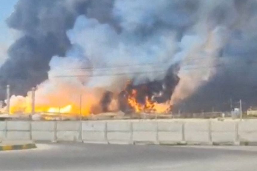 Smoke and fire rise near the South Pars gas field following an attack in Bushehr Province, Iran, March 18, in this screengrab obtained from a social media video.