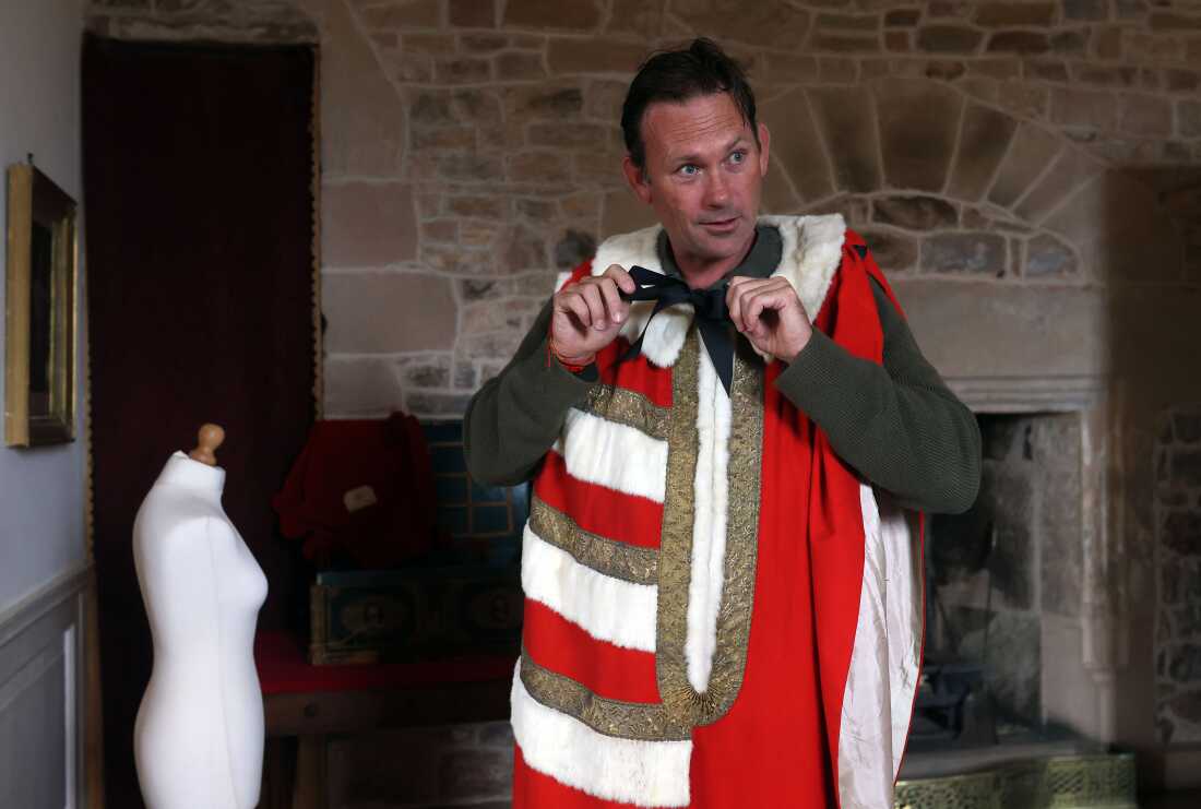 Aristocrat Charles Courtenay, 19th Earl of Devon, tries on vintage ceremonial robes for the State Opening of Parliament.   