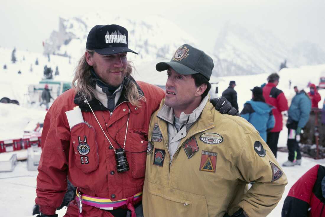 American actor Sylvester Stallone and director Renny Harlin on set of Harlin's film Cliffhanger.