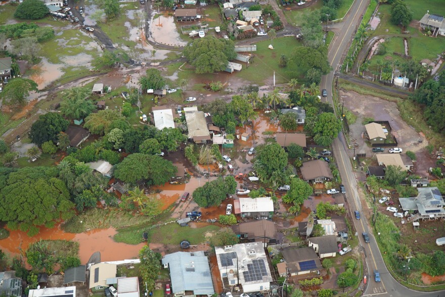 An ariel view of a neighborhood in Waialua still waterlogged and covered in thick mud a day after devastating flooding. March 21, 2026