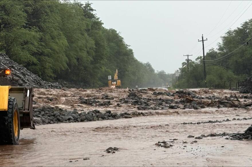 Kamehameha V Highway on Moloka‘i blocked by water, mud and debris on March 21, 2026. A crew is on scene working to clear the roadway.