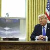 President Trump speaks as an image of an F-47 fighter jet is displayed in the Oval Office in Washington on Friday.