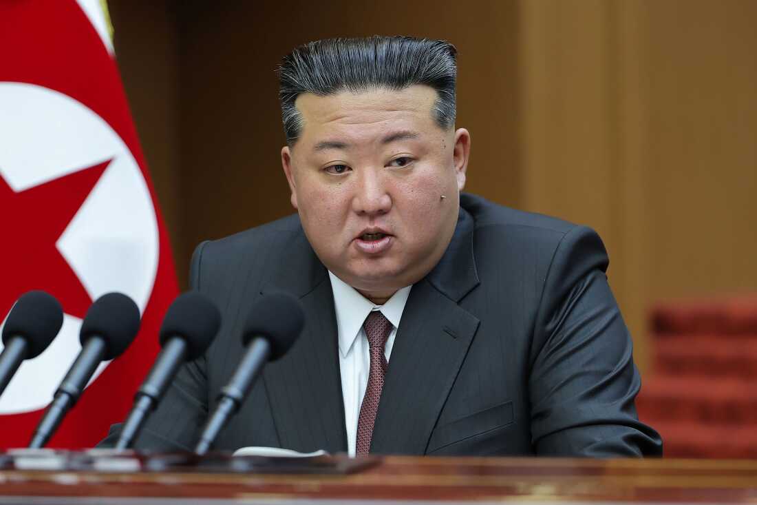 In this photo provided by the North Korean government, its leader Kim Jong Un delivers a speech during a session of the Supreme People’s Assembly at parliament in Pyongyang, North Korea Monday, March 23, 2026.