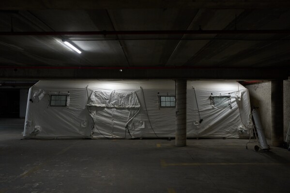 A temporary emergency ward is set up in a parking garage used as a shelter beneath Sheba Medical Center in Ramat Gan, Israel, Tuesday, March 17, 2026. (AP Photo/Oded Balilty)