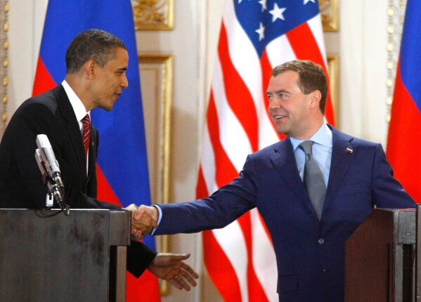U.S. President Barack Obama, left, and his Russian counterpart Dmitry Medvedev, right, shake hands at a news conference at the Prague Castle in Prague, Czech Republic,, April 8, 2010, after signing the New START treaty reducing long-range nuclear weapons. (AP Photo/Mikhail Metzel, File)