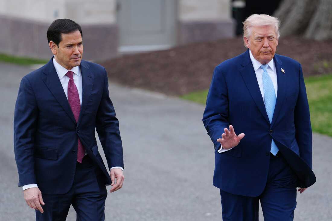 President Donald Trump walks with Secretary of State Marco Rubio to speak with reporters before departing on Marine One from the South Lawn of the White House, Friday, March 20, 2026, in Washington.