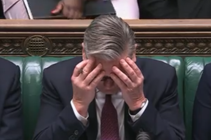 Keir Starmer speaking at Prime Ministers Questions in the UK Parliament, addressing key issues with government officials.