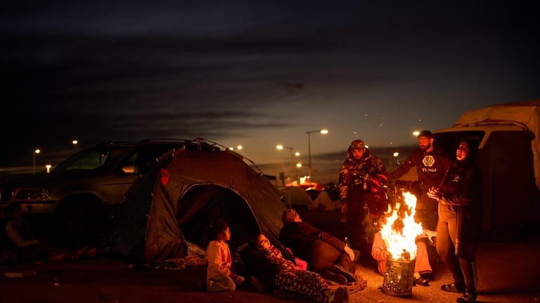 Members of a family, who fled Israeli strikes in southern...
