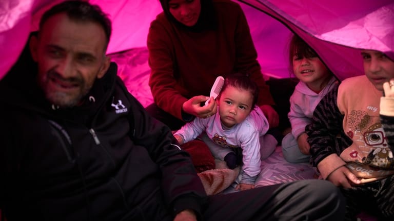 Members of the displaced Abd el-Hajj family, and two of...