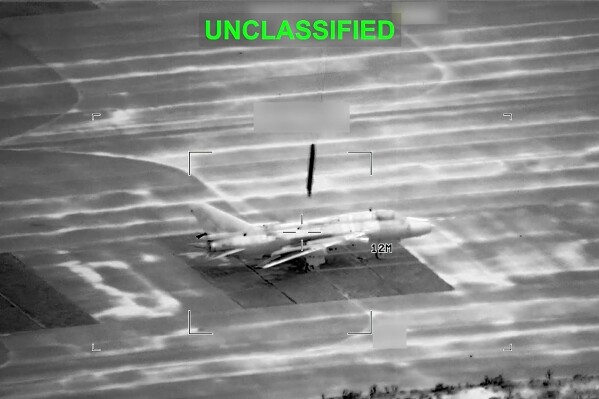 This partially redacted image from video provided by U.S. Central Command shows a military aircraft in Iran shortly before it was struck by a missile fired by U.S. forces on Sunday, March 1, 2026. (U.S. Central Command via AP)