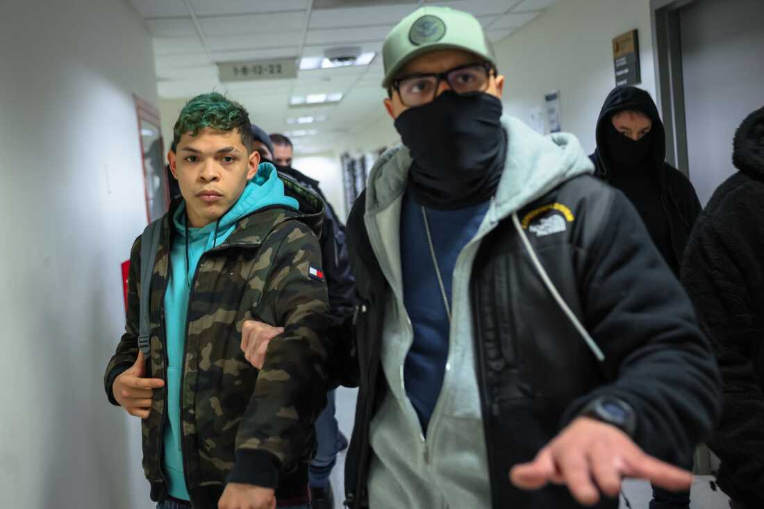 A man from Venezuela is detained by masked federal agents after his hearing in immigration court at the Jacob K. Javits Federal Building on January 28, 2026 in New York City.