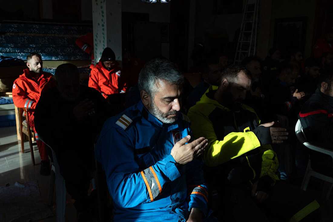 Mohammed Suleiman weeps as he prays with his comrades during an Ashura ceremony held in memory of his son, Joud, and his friend Ali Hassan Jaber, who were killed in an Israeli drone strike while riding a motorbike behind an ambulance in Nabatieh, Lebanon, on March 27, 2026.